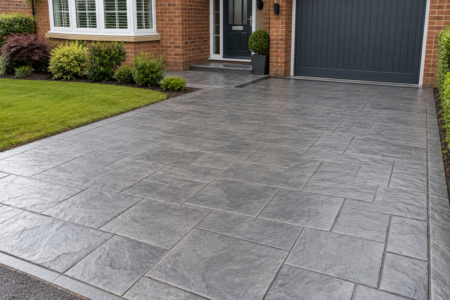 Illustrative grey slate pattern-imprinted concrete driveway
